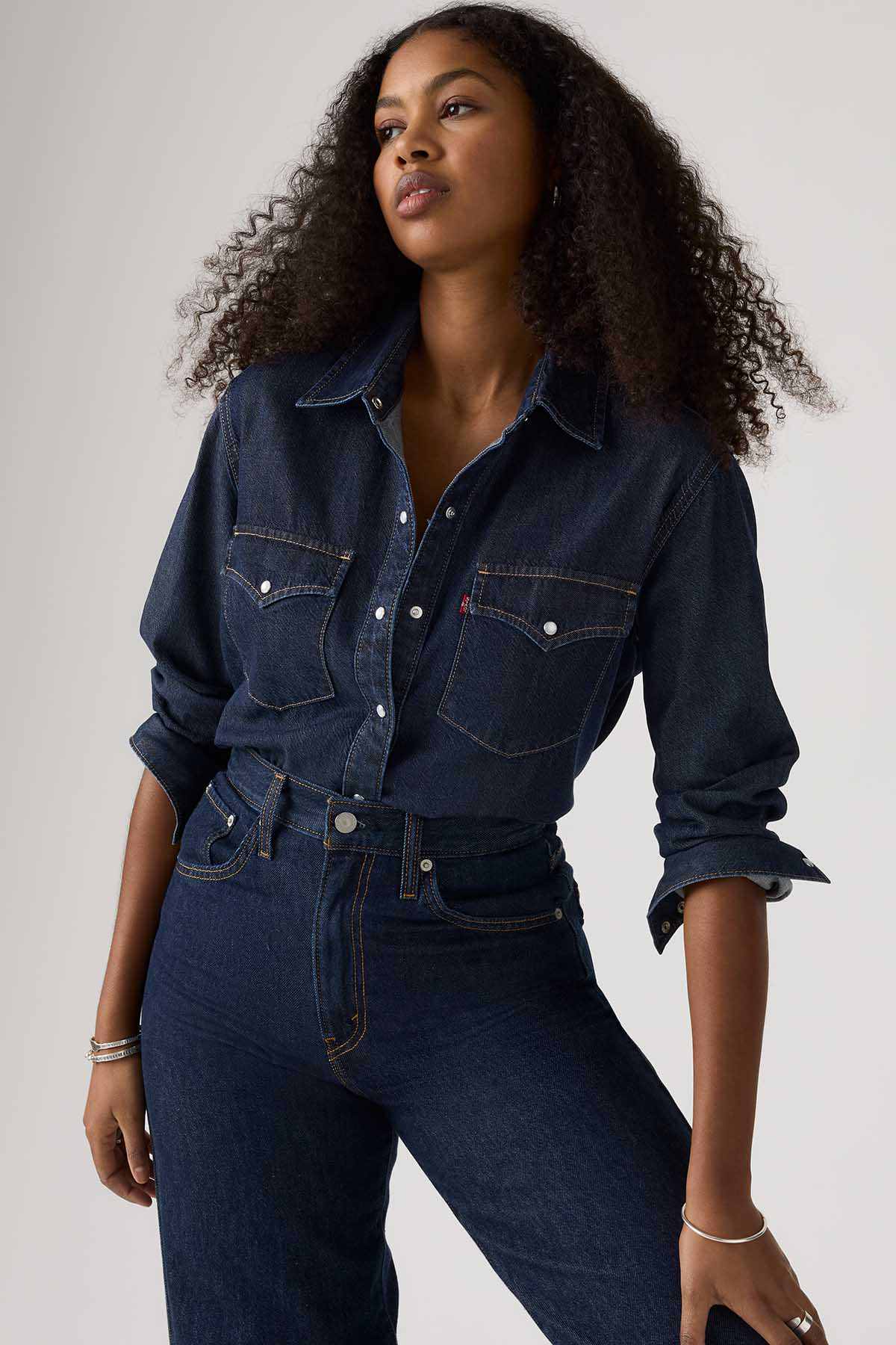 Levi's dark denim button-up with two chest flap pockets and button cuffs