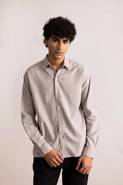 Grey button-up shirt on model, long sleeves, button front, pointed collar