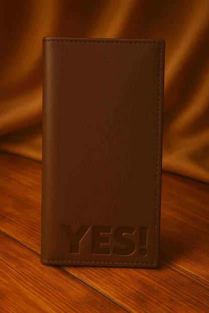 Brown leather wallet with 'YES!' embossing and stitched edges