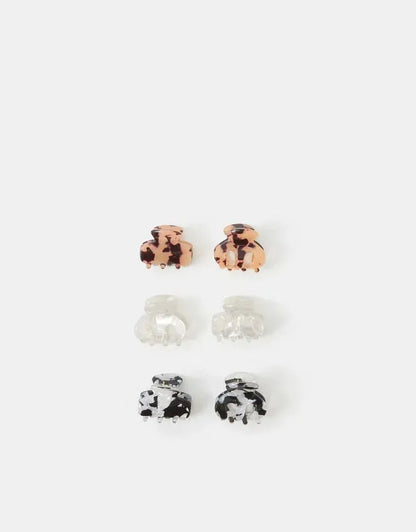 Mini hinged hair claw clips in tortoiseshell brown, clear, and black-white patterns