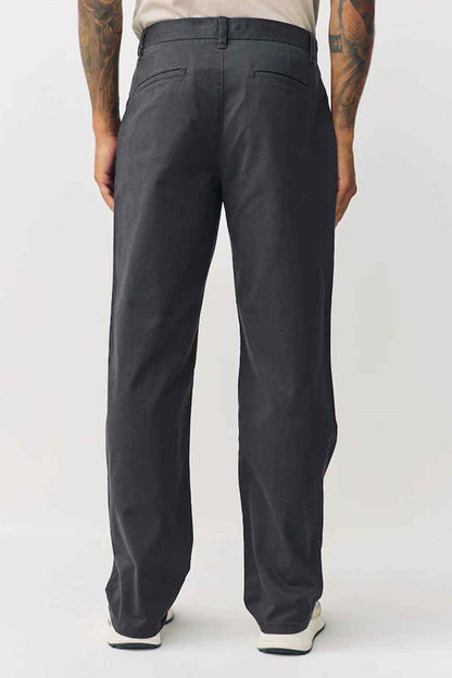 Dark grey trousers from back view with crease and back pockets