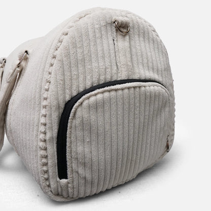 Cream textured duffel bag with curved front pocket, black zip trim, and metal hook