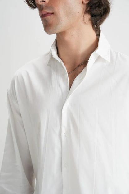 Brackets white button-up shirt close-up of collar, placket, and top buttons