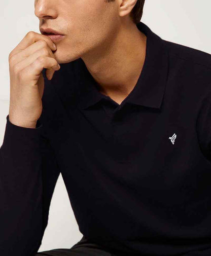 Fitted dark long-sleeve polo shirt with collar, button placket, and small chest logo.