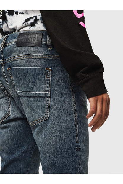 Diesel patch label on back waistband of blue denim jeans