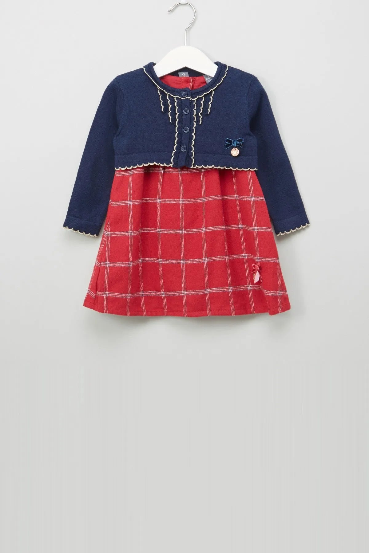 Baby dress in dark blue and red plaid, button front, scalloped trim, long sleeves