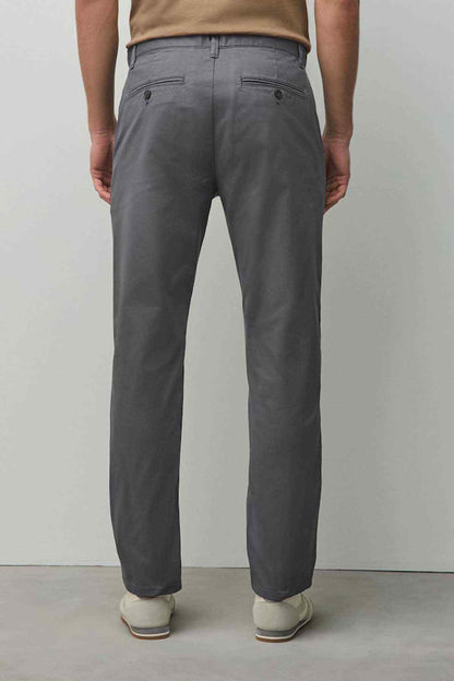 Dark grey chino trousers full view with belt loops and button fly