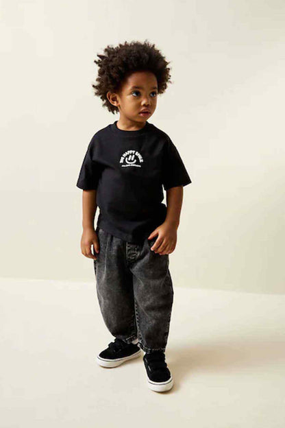 Kids black T-shirt with front smile graphic, short sleeves and crew neck