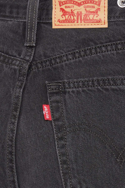 Black denim jeans front pocket stitching with red Levi's brand patch