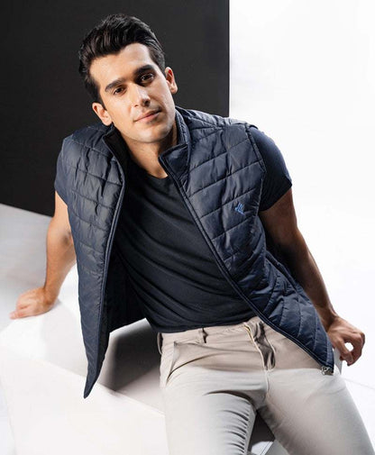 Dark blue quilted sleeveless vest with zip-front and stand collar