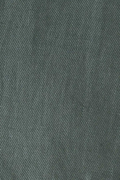 Green woven suit fabric texture close-up