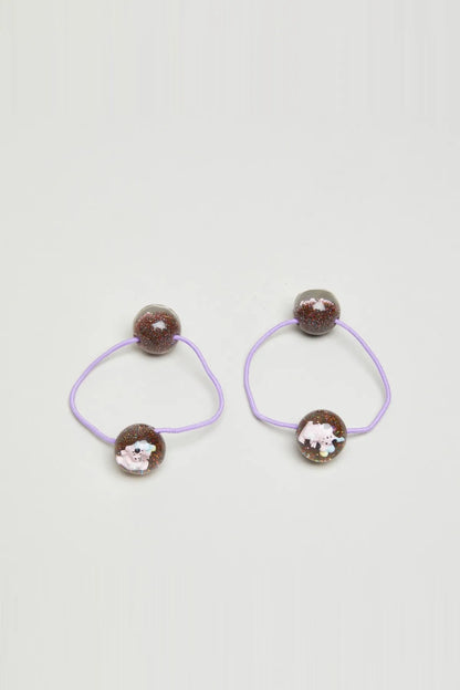 Two kids hair elastics with lilac elastic loops and glitter brown bead charms