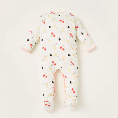 White baby footie sleeper with multicolor fruit print, long sleeves, open feet