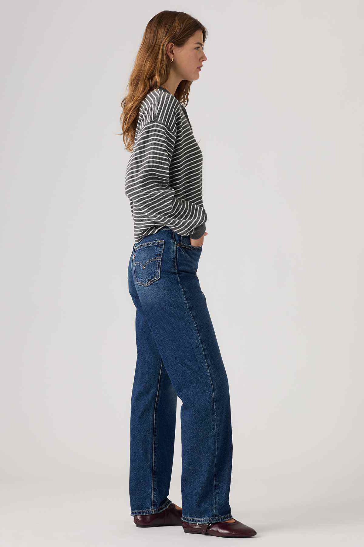 Dark indigo denim jeans with belt loops and visible side seam