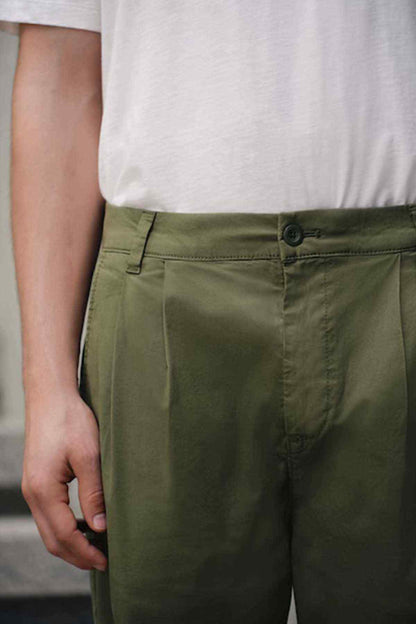 Olive green trousers front with waistband, belt loops, and button