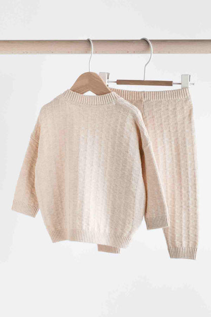 Baby knit sweater and pants set, light pink textured knit on hangers