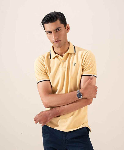 Yellow fitted polo shirt with button placket and dark-trim collar, short sleeves