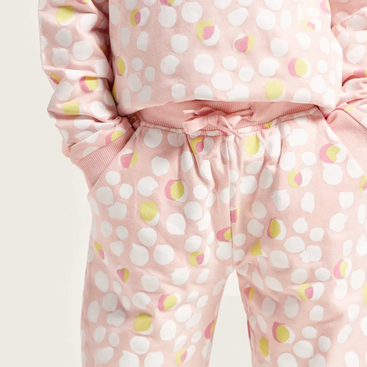 Pink dot-print joggers with elastic drawstring waist and ribbed cuffs