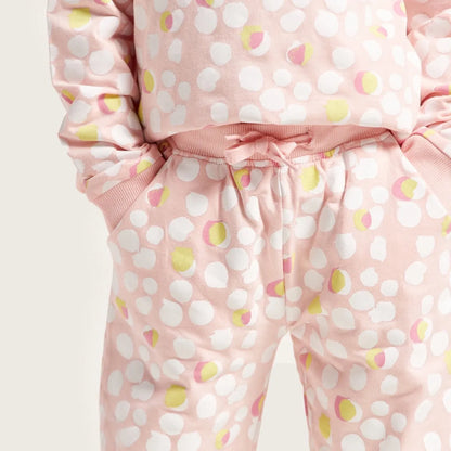 Pink dot-print joggers with elastic drawstring waist and ribbed cuffs