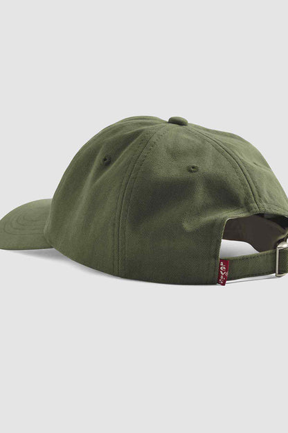 Dark green baseball cap side view with adjustable strap and logo tag