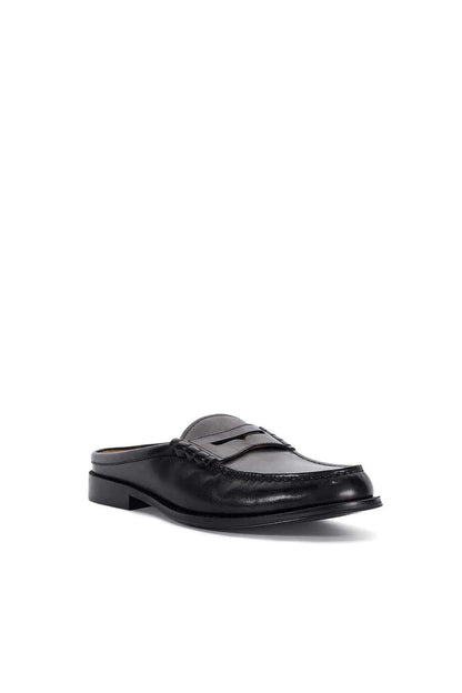 Black leather mule loafer with strap and moc toe stitching, low block heel