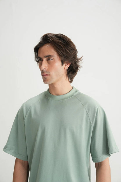 Teal crew-neck short-sleeve T-shirt neckline and shoulder seam detail
