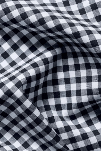 Close-up of blue-and-white gingham check fabric texture