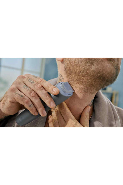 Dark gray beard trimmer being used on neck and jaw