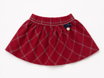 Red plaid baby skirt with elastic waistband and button detail