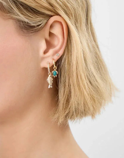 Gold-tone hoop earring with turquoise bead and dangling crystal mesh