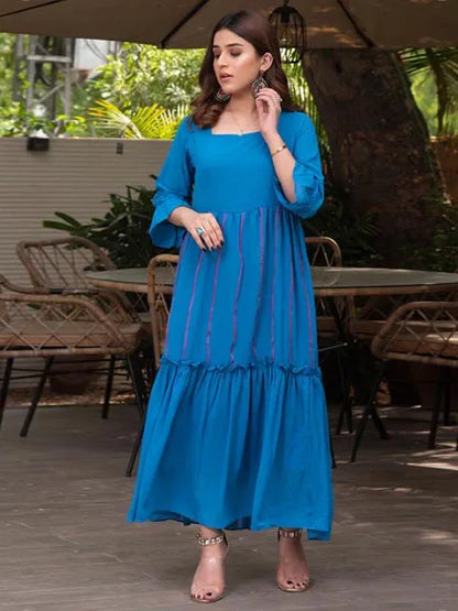 Nazmina blue tiered maxi dress with vertical contrast trim and flared sleeves, front