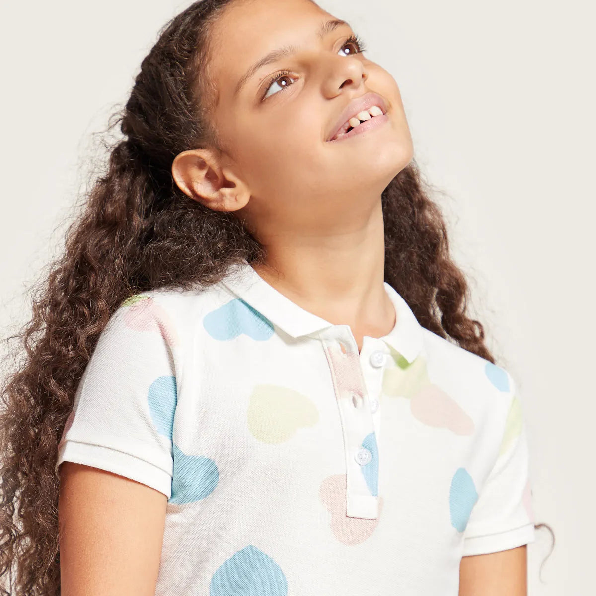 Kids' polo shirt collar with pastel cloud pattern and 3-button placket