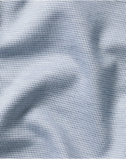 Light blue textured knit fabric close-up