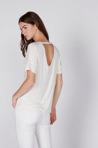 White women's graphic T-shirt with scoop back and short sleeves