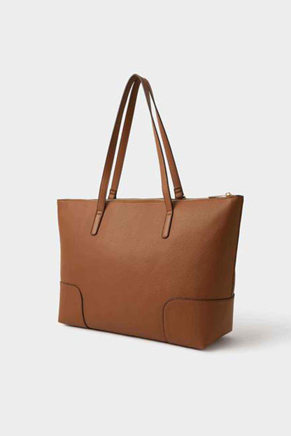 Tan roomy tote bag with stitched panels and two top handles