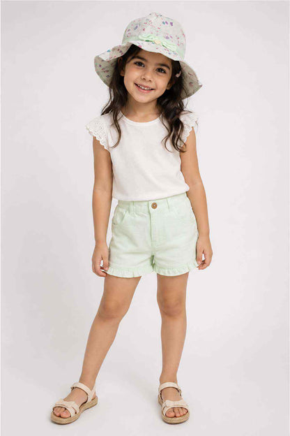 Kids bucket hat in light print fabric with mint trim and bow