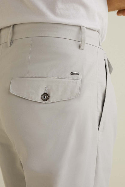 Beige trousers side pocket with button and curved seam