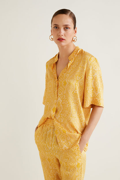 Yellow patterned short-sleeve jumpsuit with button-front and elastic waist
