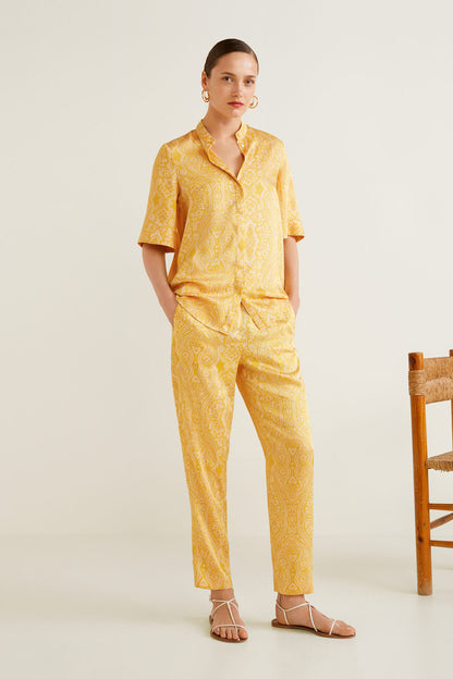 Yellow patterned jumpsuit with short sleeves, elastic waist, tapered legs