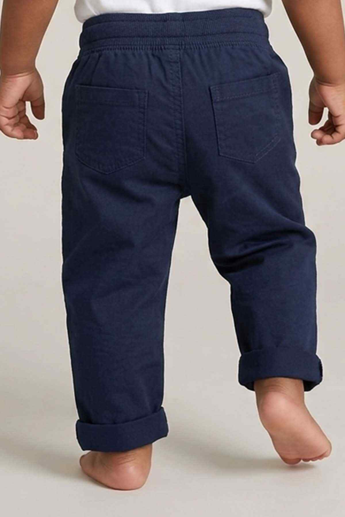 Navy baby pants with front pockets and elastic waistband, cuffed ankle hem