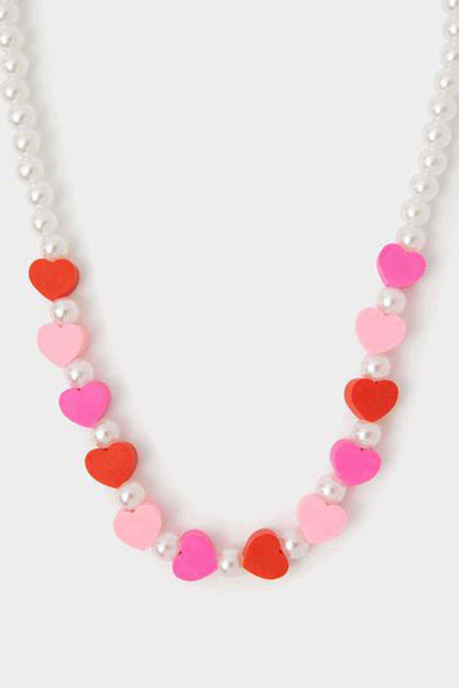 Heart bead necklace with pink and red hearts on white pearl beads