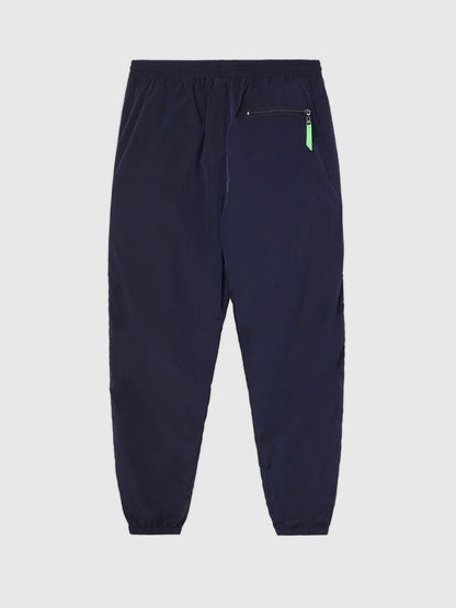 Dark navy track pants with elastic waist and small neon green zip detail