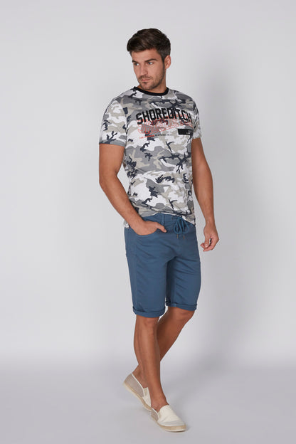 Splash camo T-shirt with black crew neck, worn with blue shorts