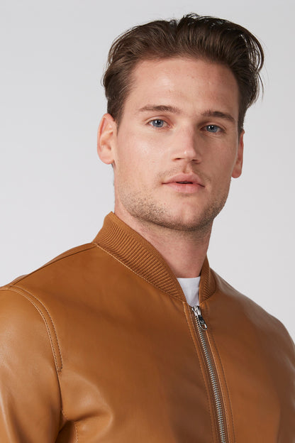 Brown leather zip-up bomber jacket with ribbed collar and knit cuffs