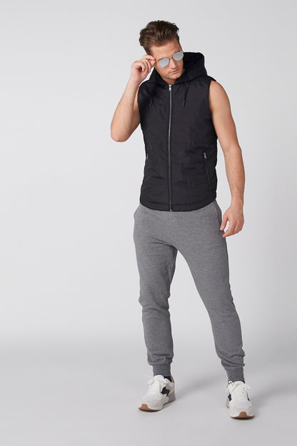 Black sleeveless hooded vest, full zip with drawstring hood and side pockets