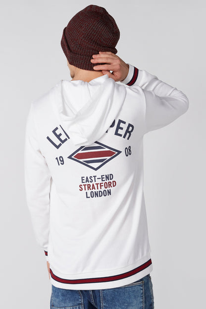 White hoodie back with large graphic print and red/blue striped ribbed hem