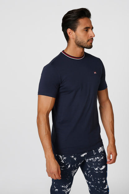 Men's navy short-sleeve T-shirt and splash-print swim shorts, side profile