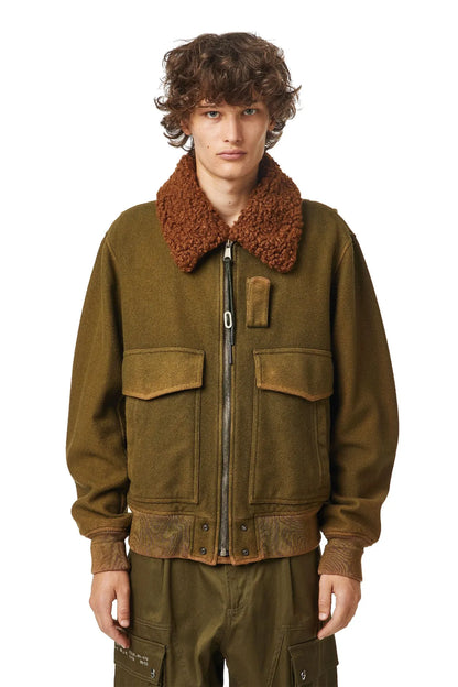 Olive green zip-up jacket with brown shearling-style collar and chest flap pockets