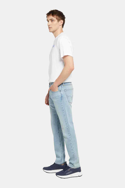 Light blue Levi's denim jeans, side view, straight leg with five-pocket styling