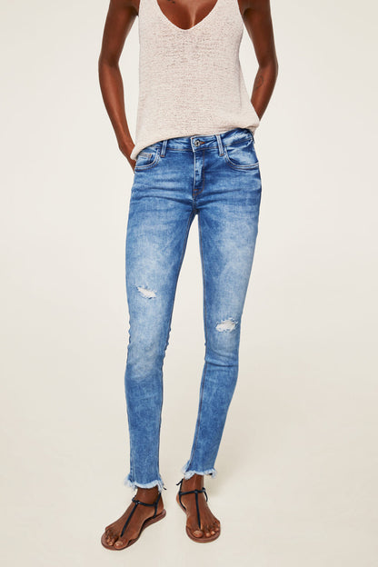 Indigo blue distressed denim jeans, ankle length, button fly